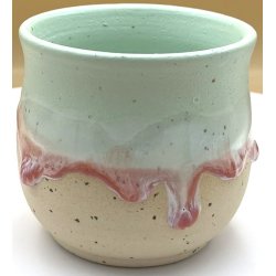 Keramik krus uden hank  lime m/r�d l�beglasur og tekst "Smuksak"